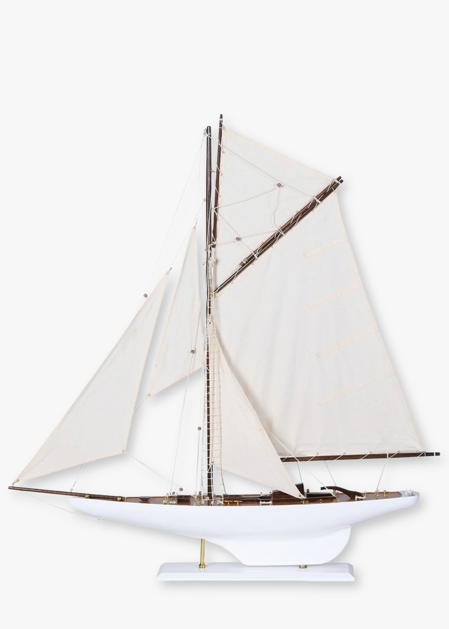 Model sailboat with white sails 
