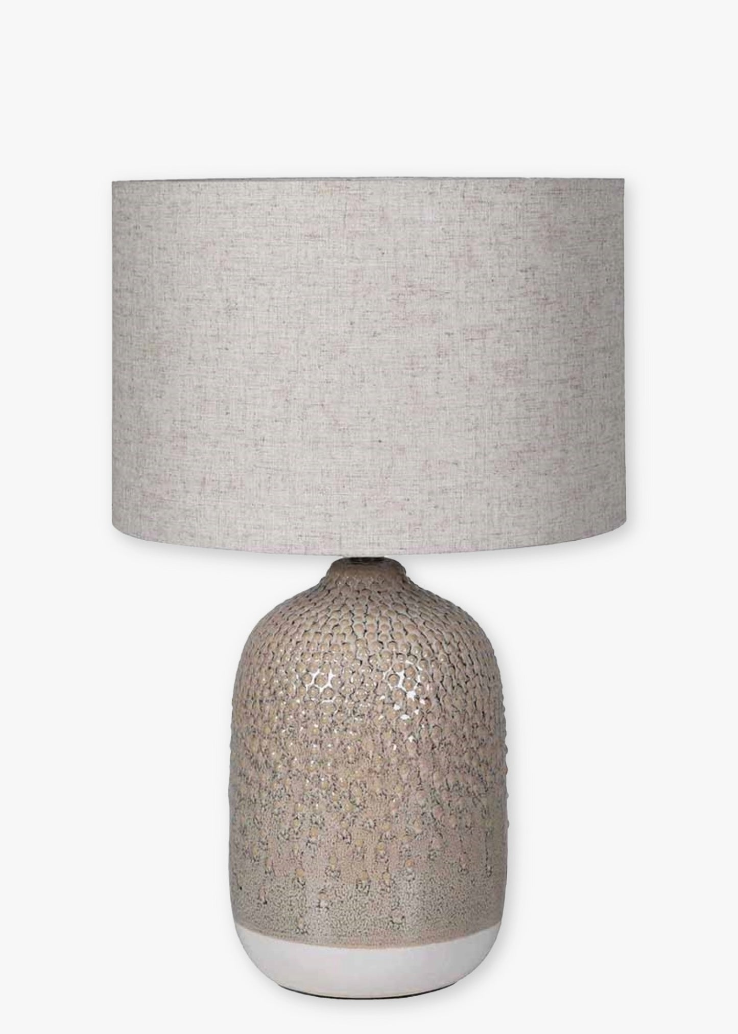 Table lamp with textured base and neutral fabric shade 