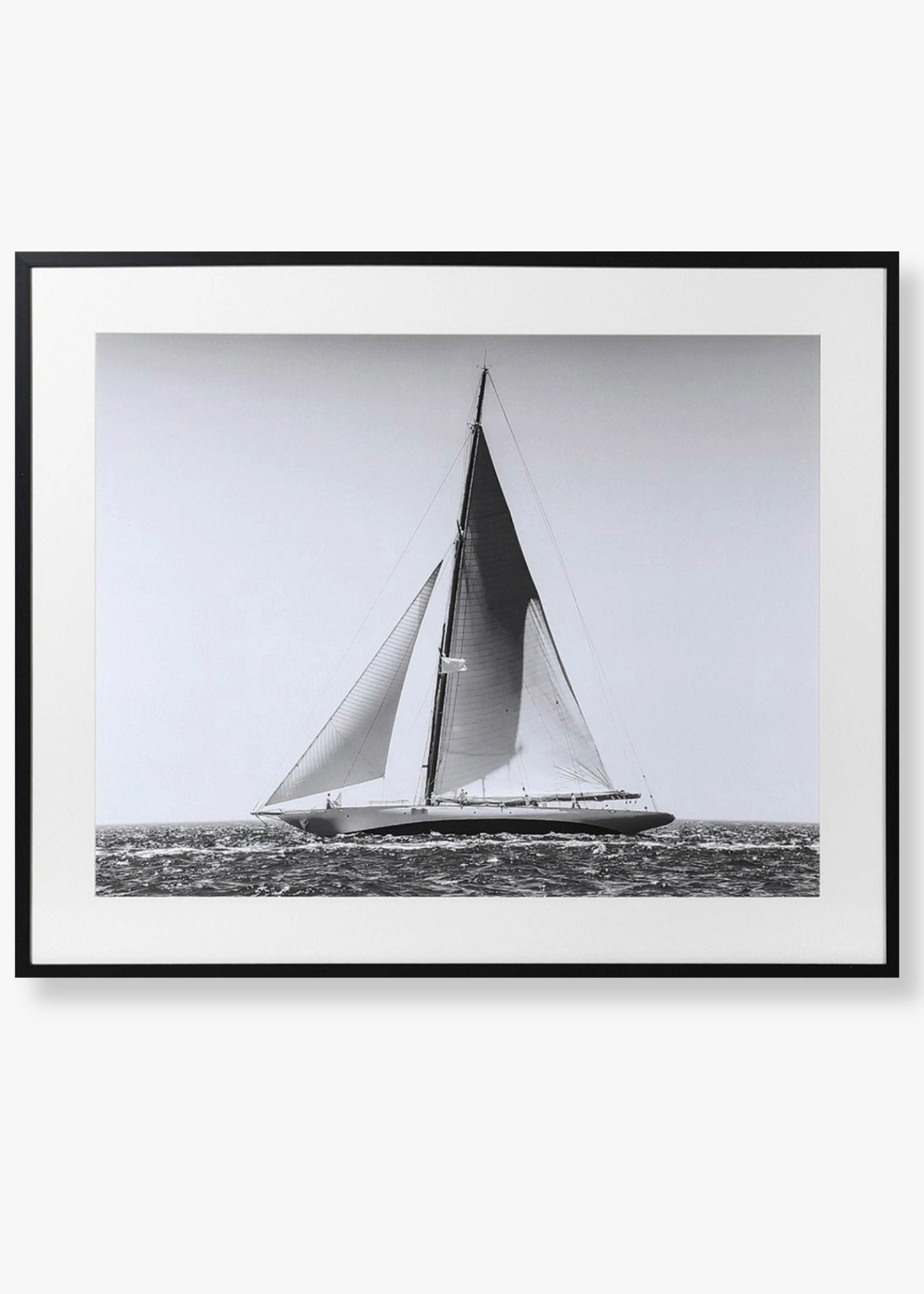 Framed black and white photograph of a sailboat on water
