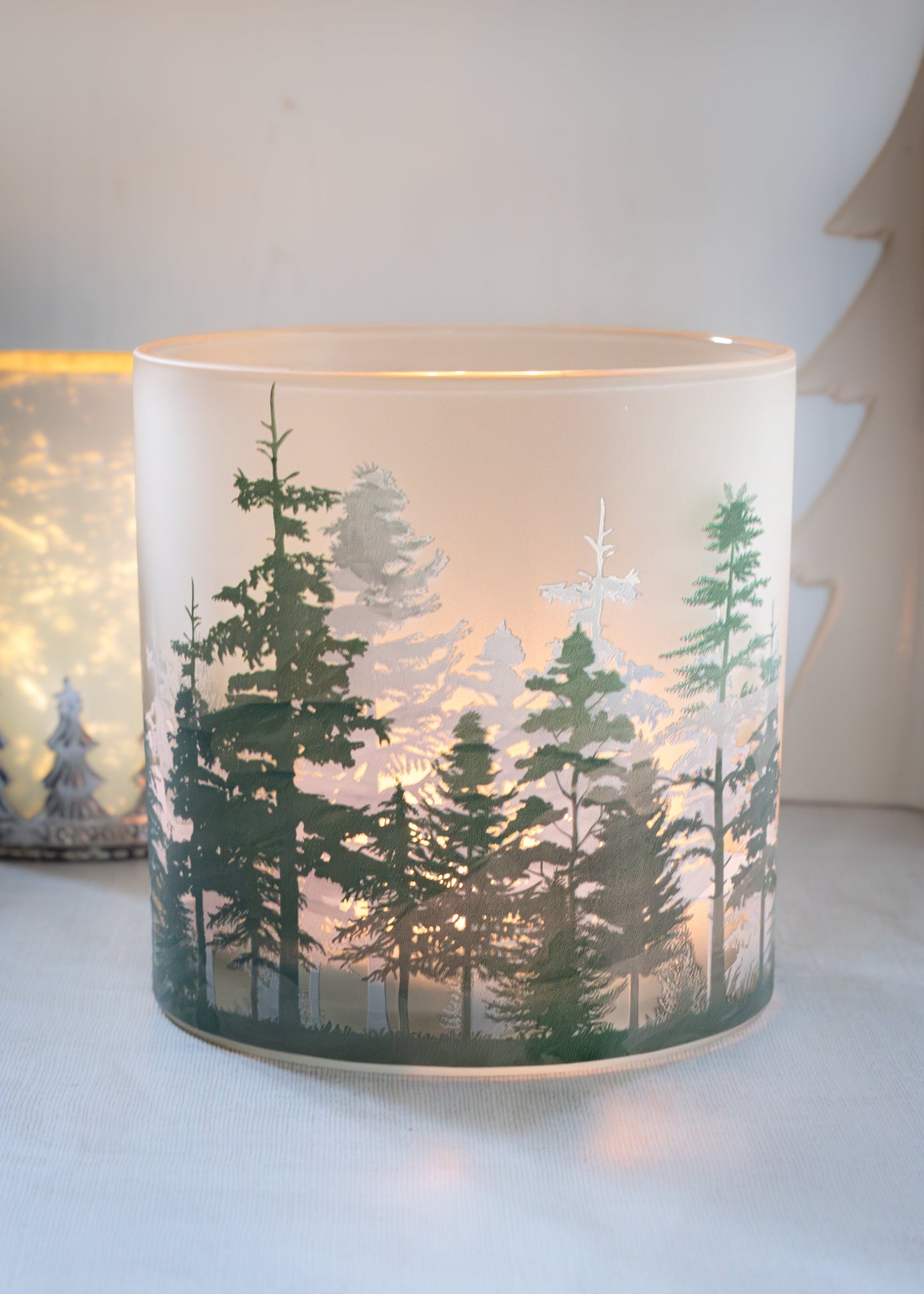 Candle holder with forest design 