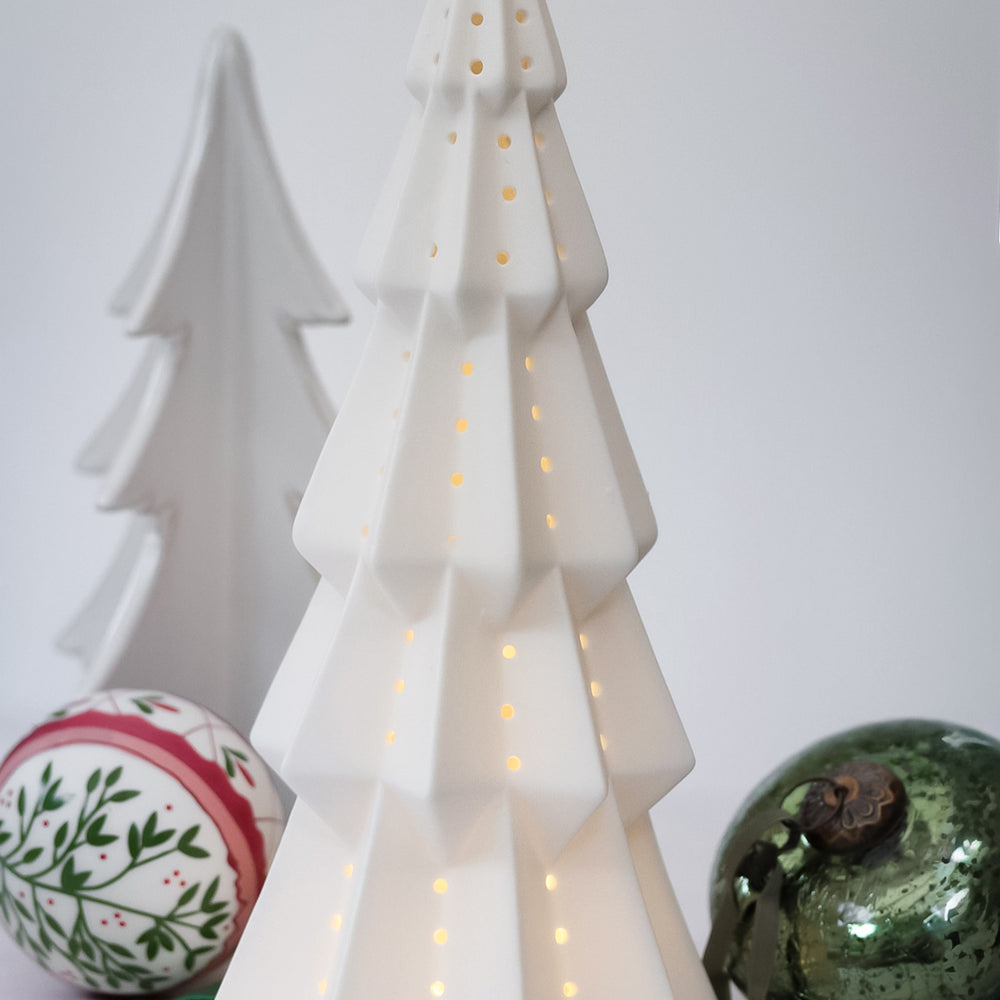 White ceramic Christmas tree with lights,