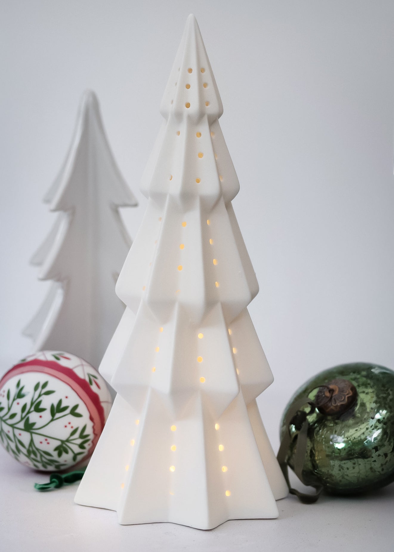 White ceramic Christmas tree with lights,