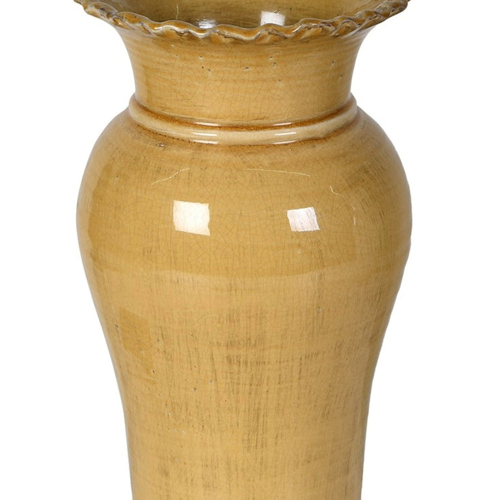 Yellow ceramic vase with textured surface 