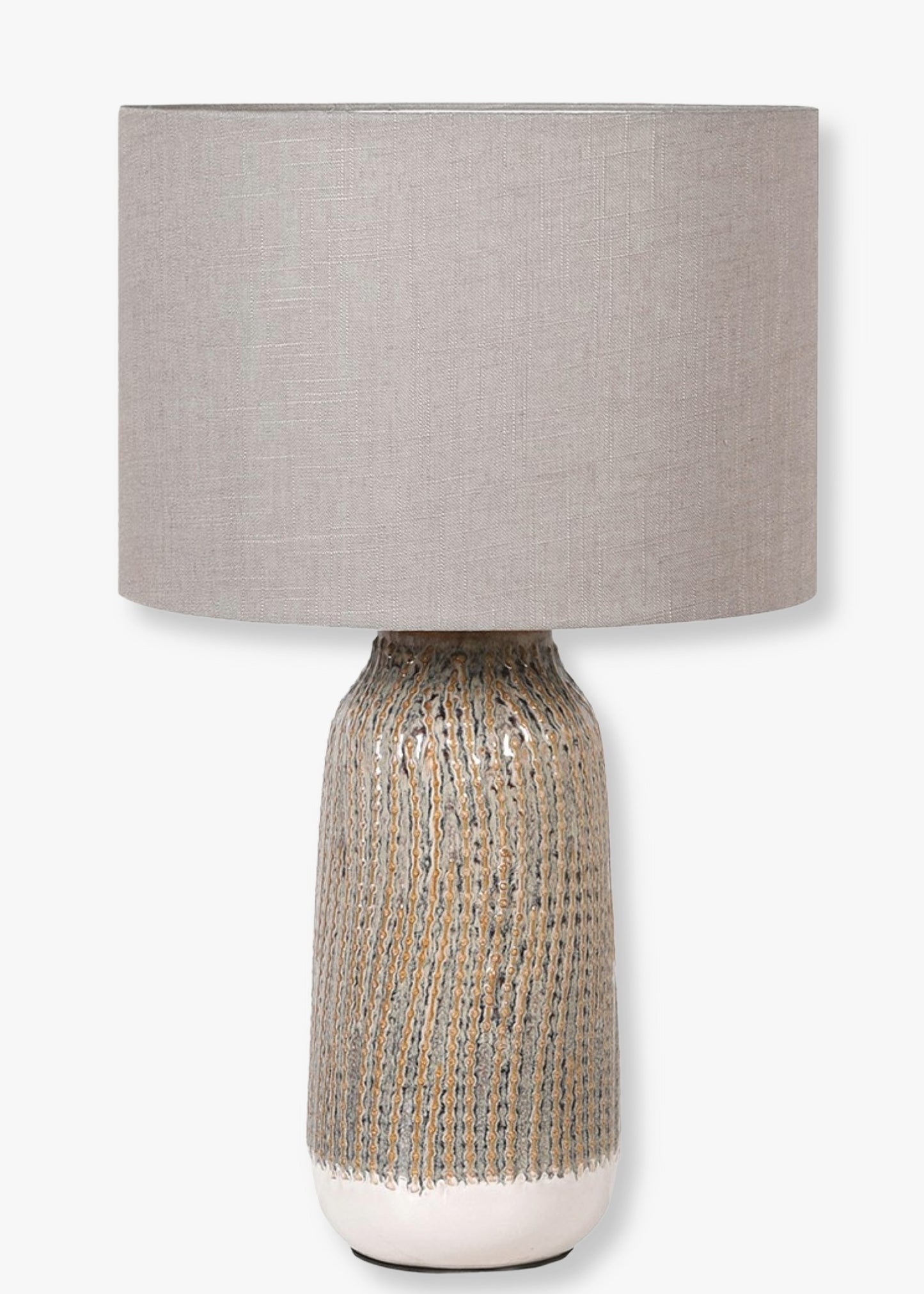 Table lamp with textured ceramic base and neutral fabric shade 