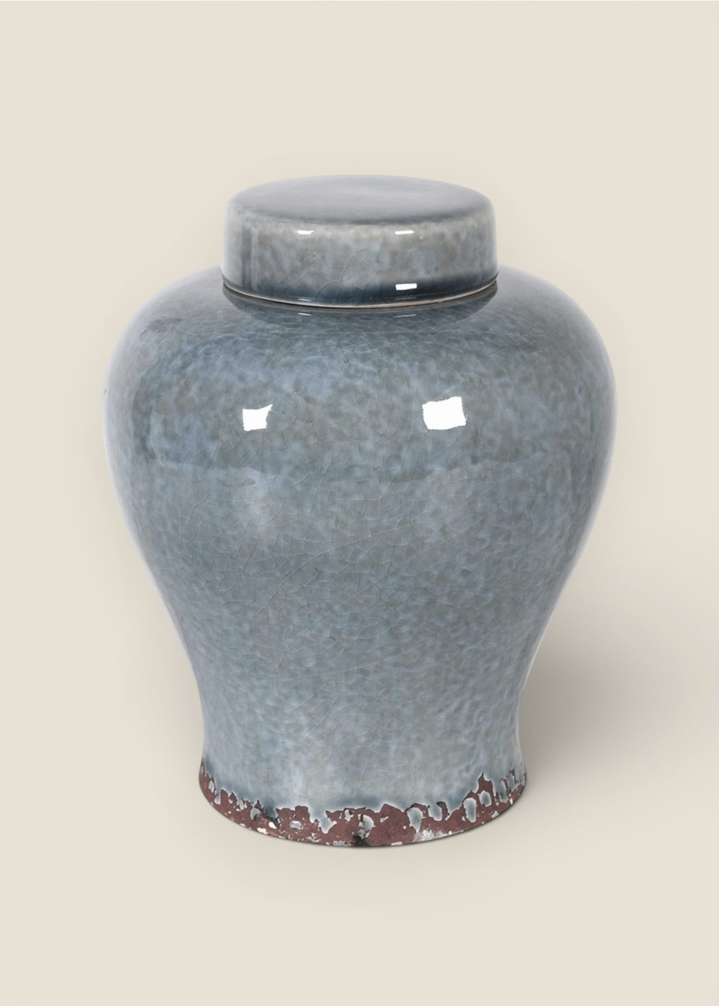 A glossy ceramic lidded jar or urn in a mottled blue-gray glaze with a small dark rim and a decorative reddish-brown textured  edge  base