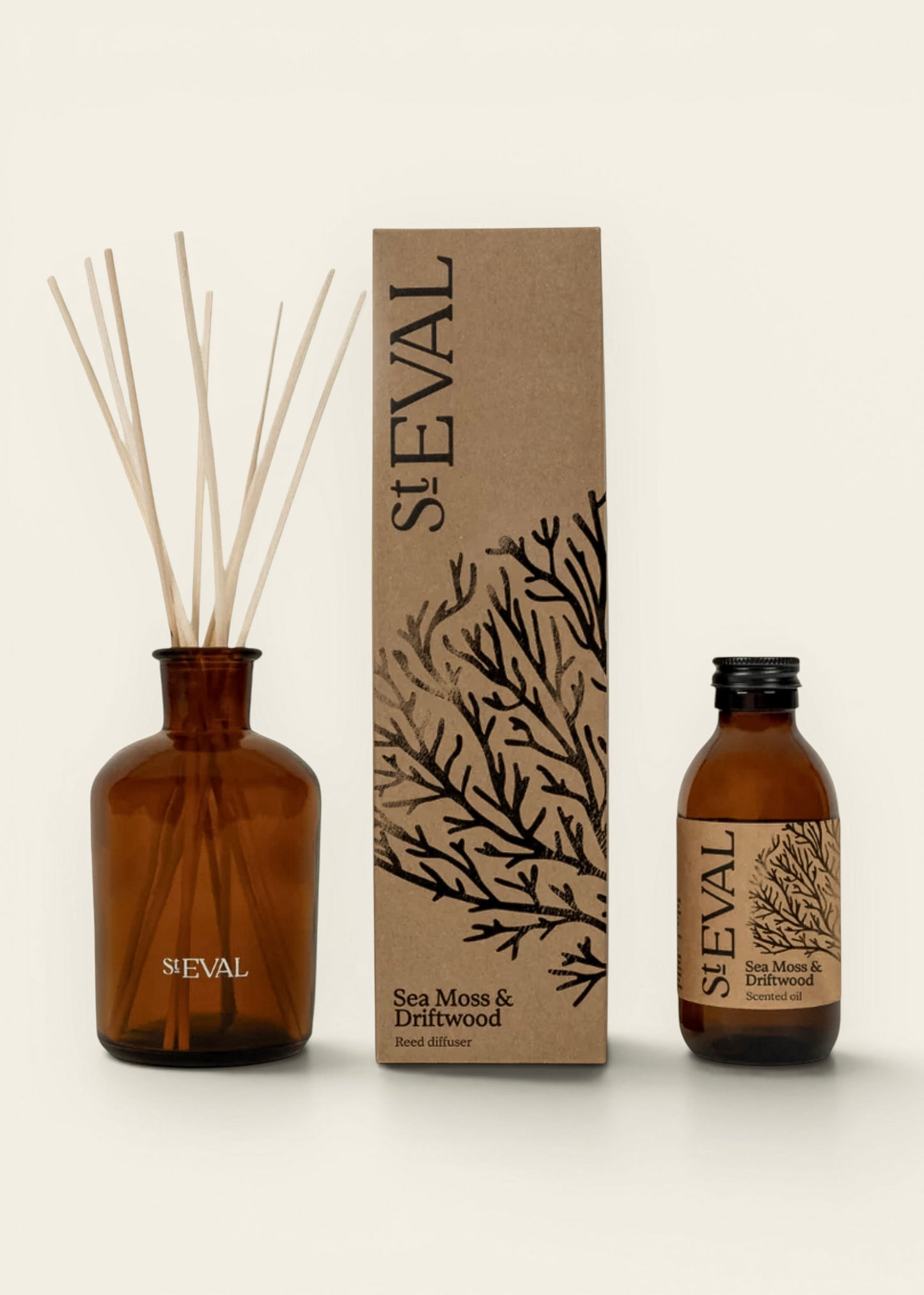 St Eval Sea Moss & Drifwood reed diffuser set, featuring an amber glass bottle with reeds.