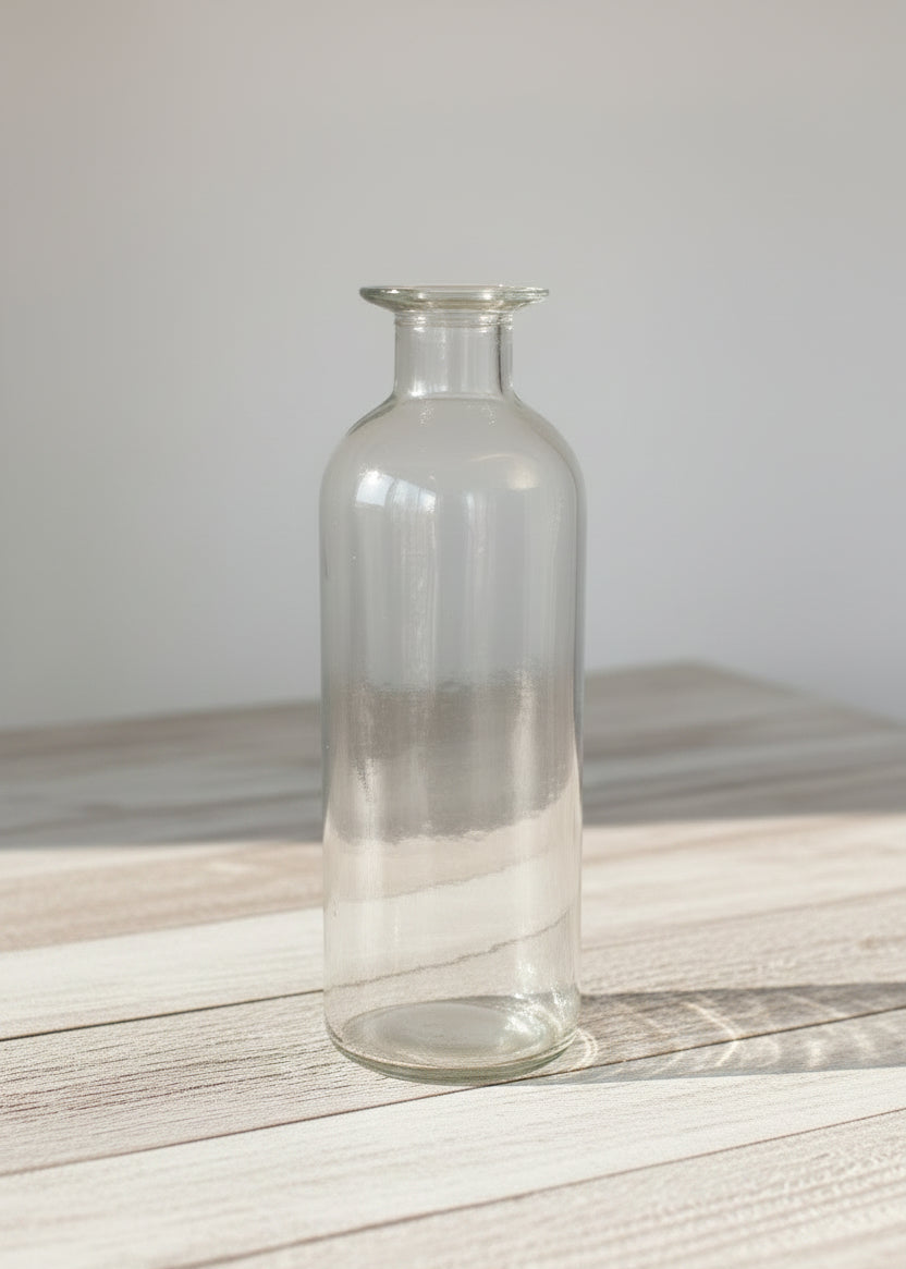Clear glass bottle bud vase
