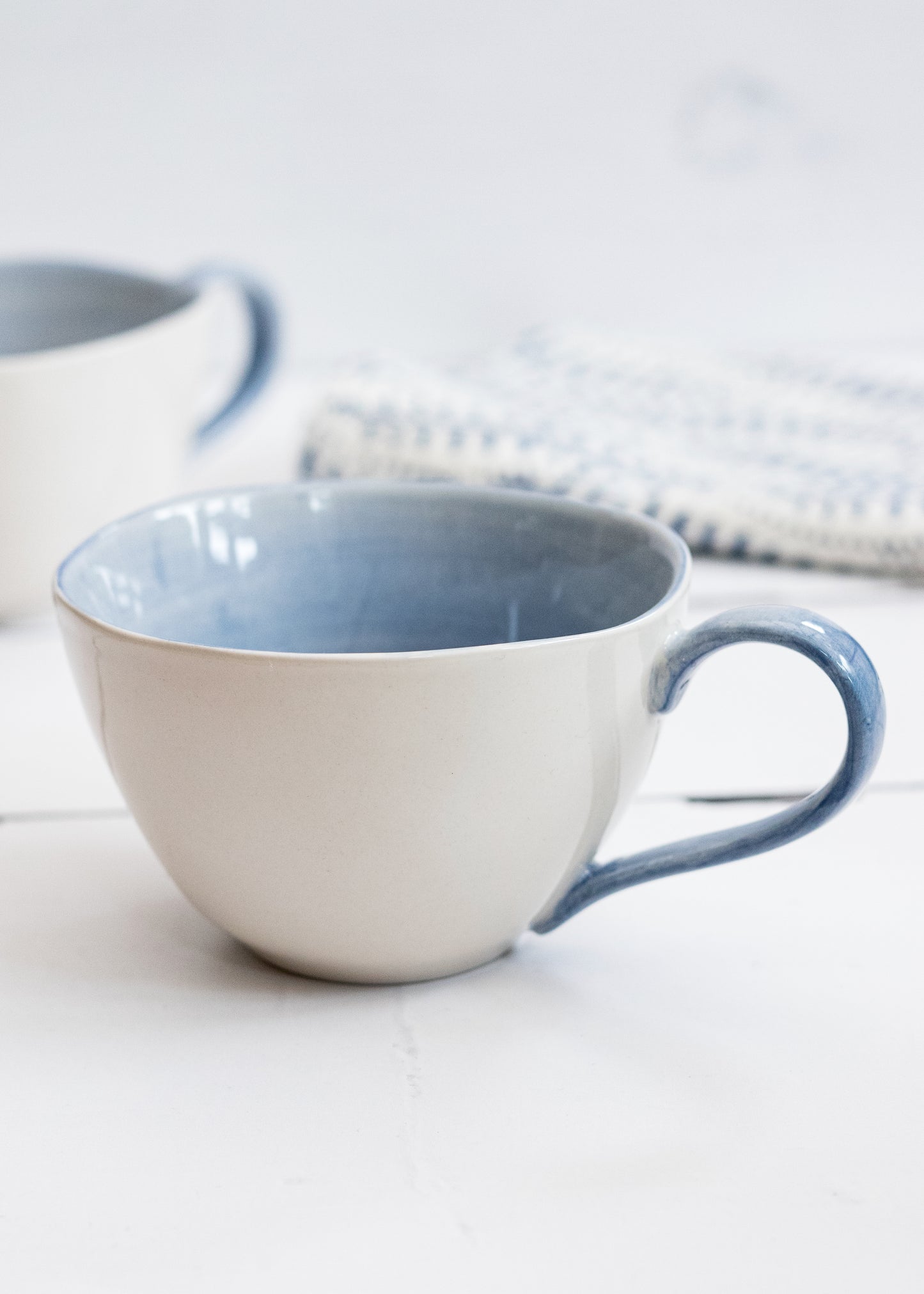 Load image into Gallery viewer, PALE BLUE &amp;amp; CREAM STONEWARE CUP
